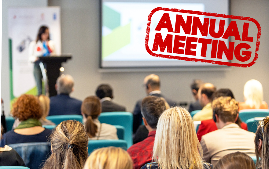 image of people meeting with "annual meeting" tag
